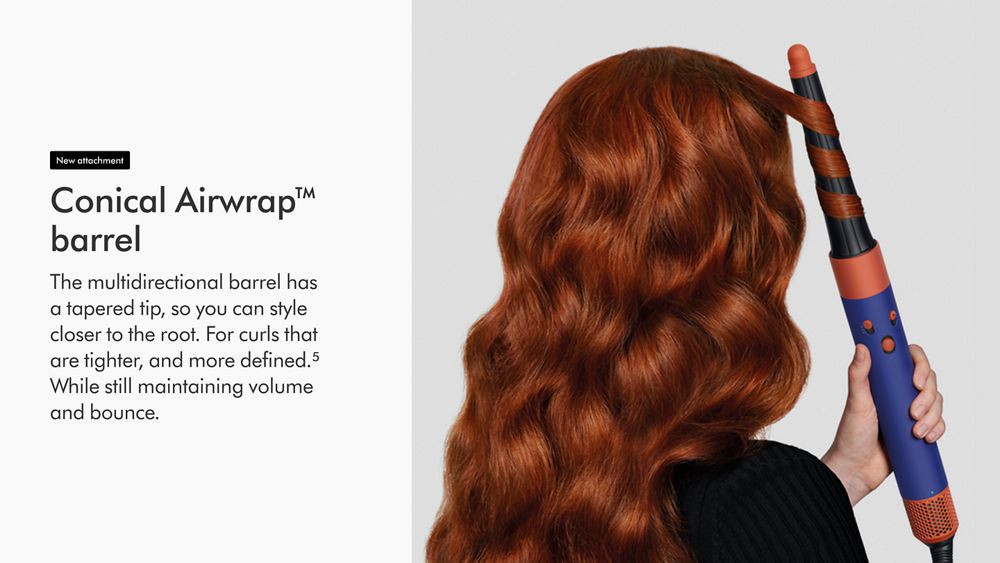 View of back of a woman's hair as she curls it with the Dyson Airwrap i.d. new attachment